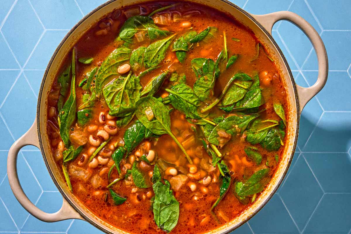 The pot of black eyed peas just after the fresh spinach was added.