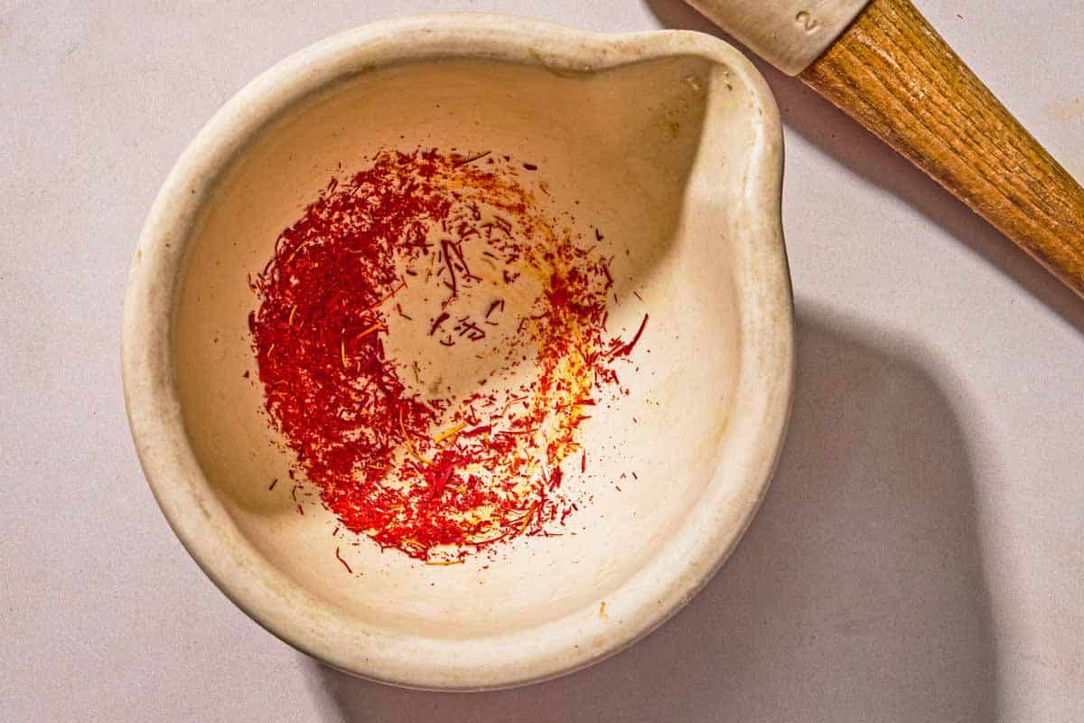 The saffron for the lamb lollipops blooming an a bowl.