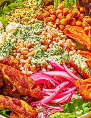 A sweet potato bowl next to a fork on a napkin.