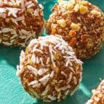 A close up of one energy ball on a platter surrounded by other energy balls.