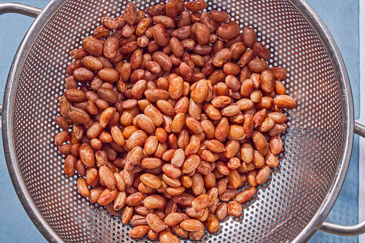 The beans for the collard green soup in a strainer.