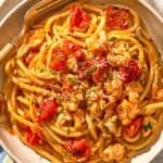 Lobster pasta in a bowl with a fork.