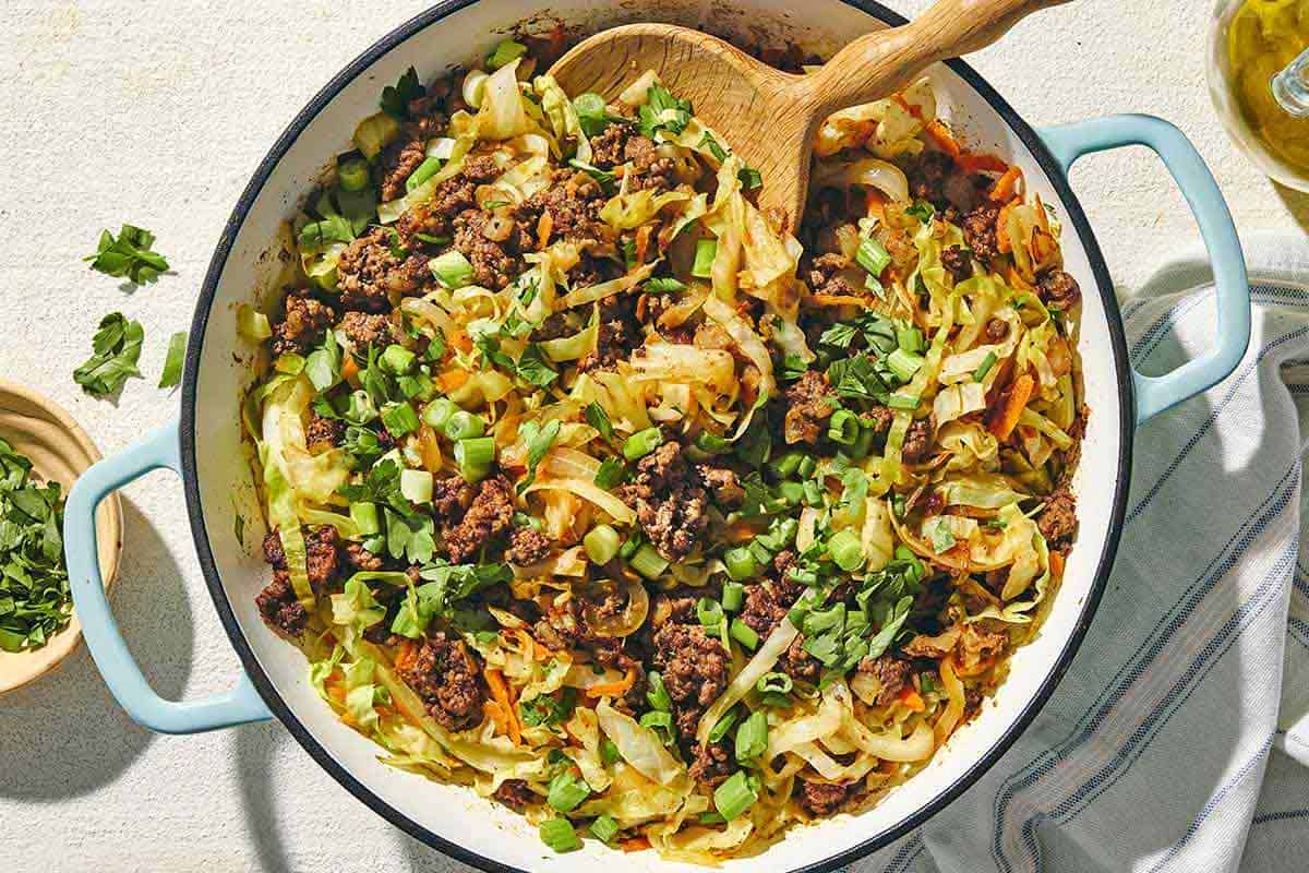 Mediterranean ground beef and cabbage skillet is a delicious high-protein, low-carb dinner on a budget! Ready in 30 mins or less