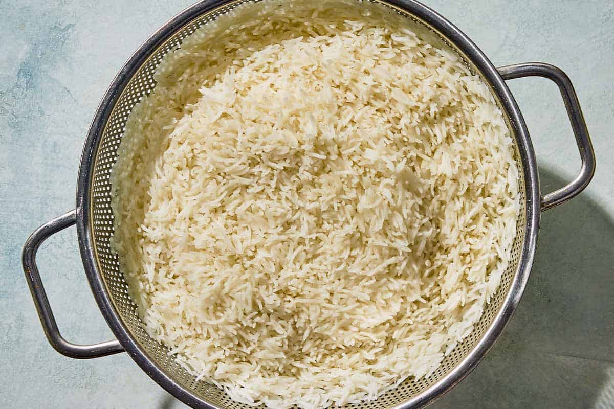 The cooked basmati rice for the loobia polo in a strainer.