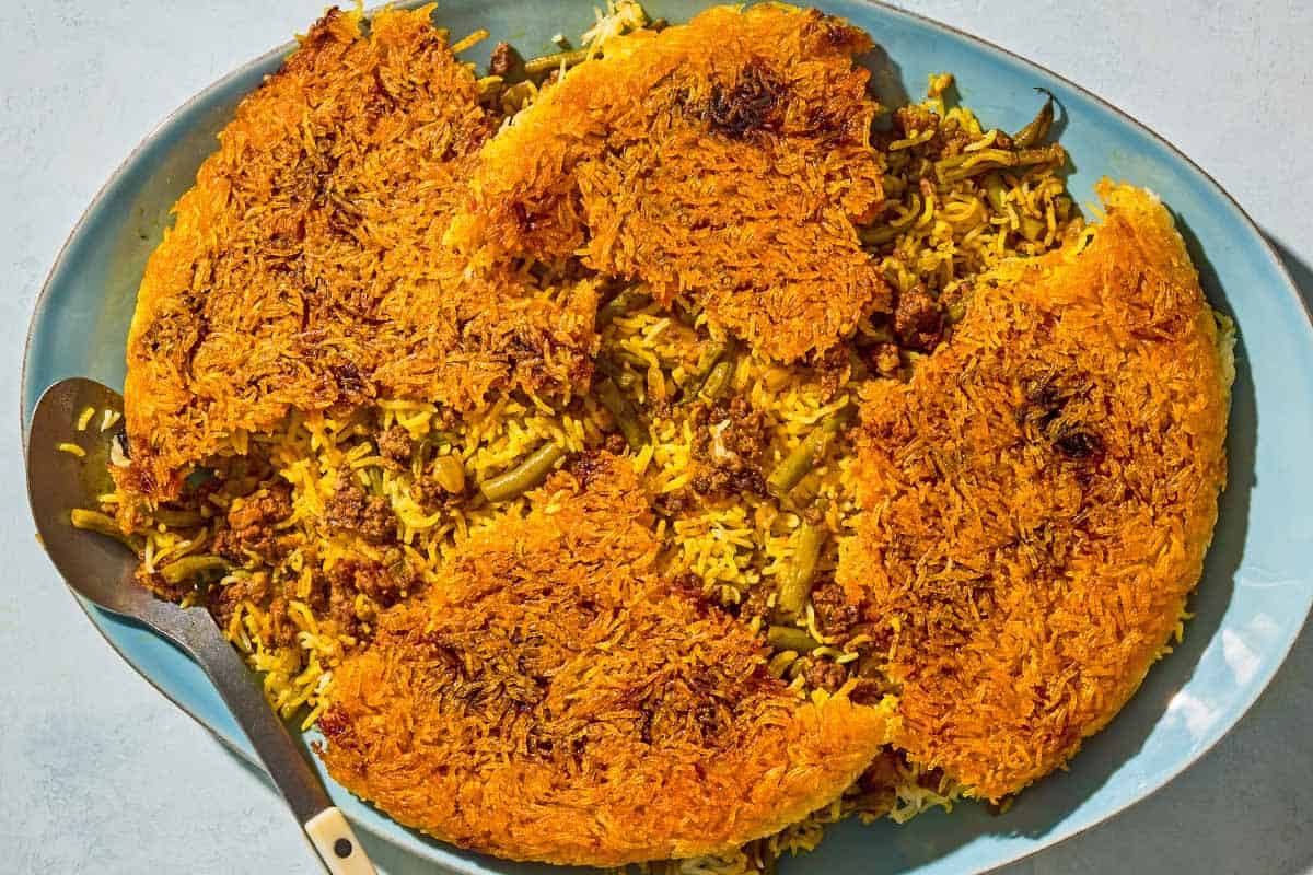 Loobia polo on a platter with a serving spoon.