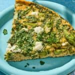 A slice of the asparagus frittata on a plate.