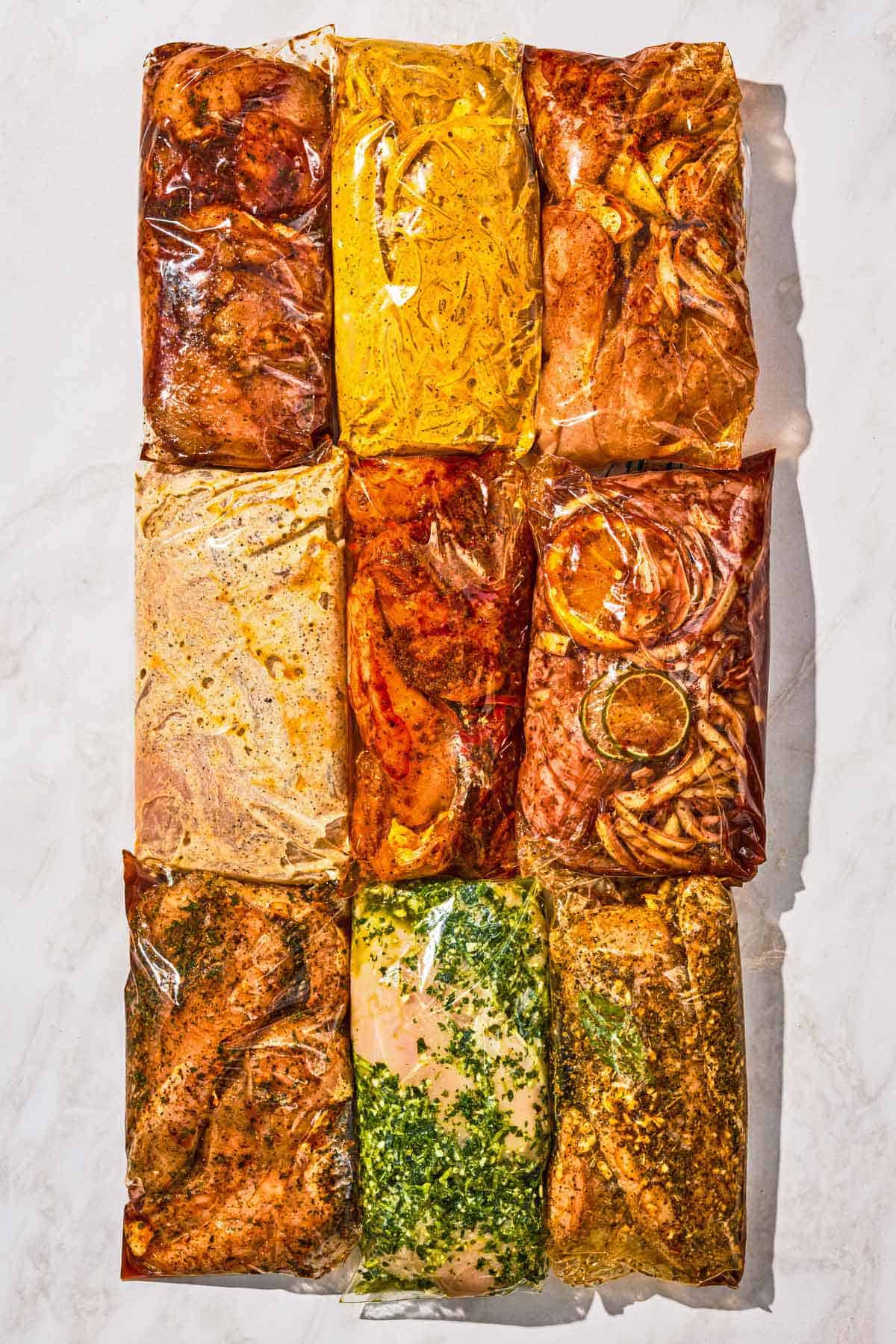 9 bags of marinating chicken. Each bag has a different chicken marinade.