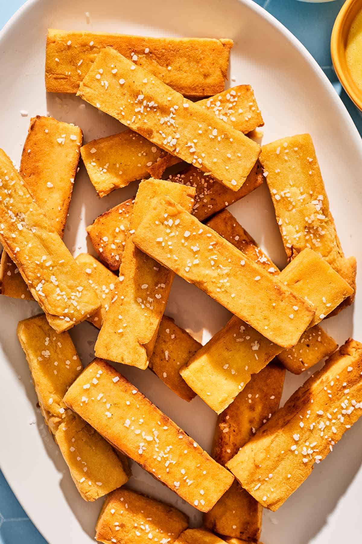 Chickpea panisses on a platter.