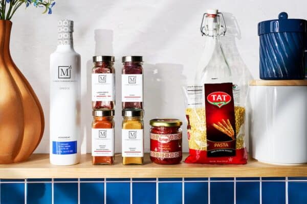 The Mediterranean Dish spices and olive oils on a kitchen counter.