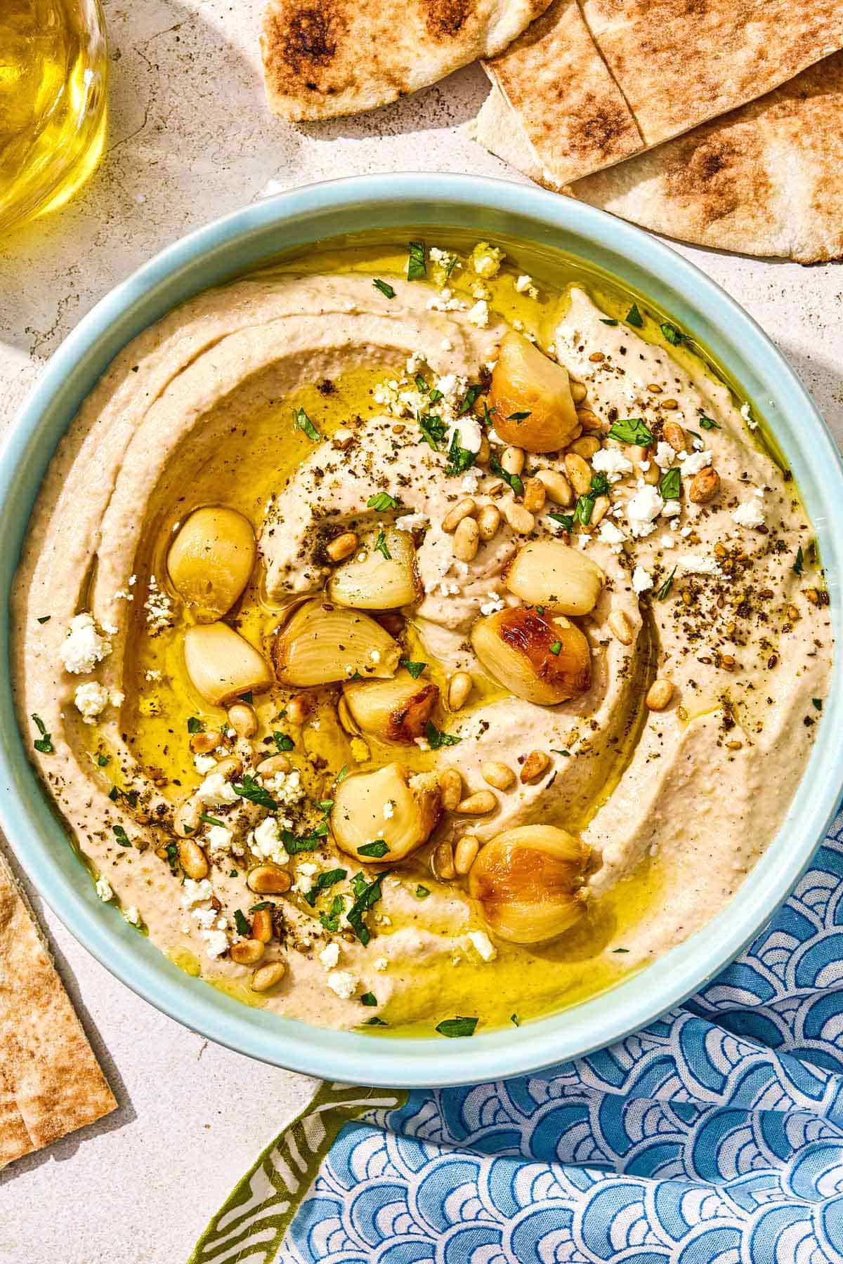 Roasted garlic hummus in a bowl.