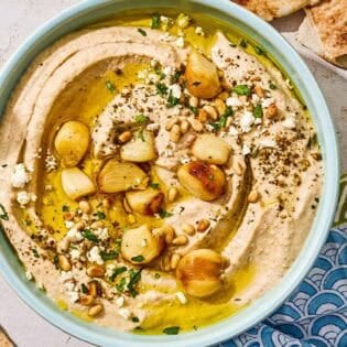 Roasted garlic hummus in a bowl.