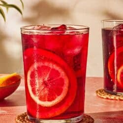 A glass of tinto de verano, a refreshing Spanish wine drink, on a coaster.