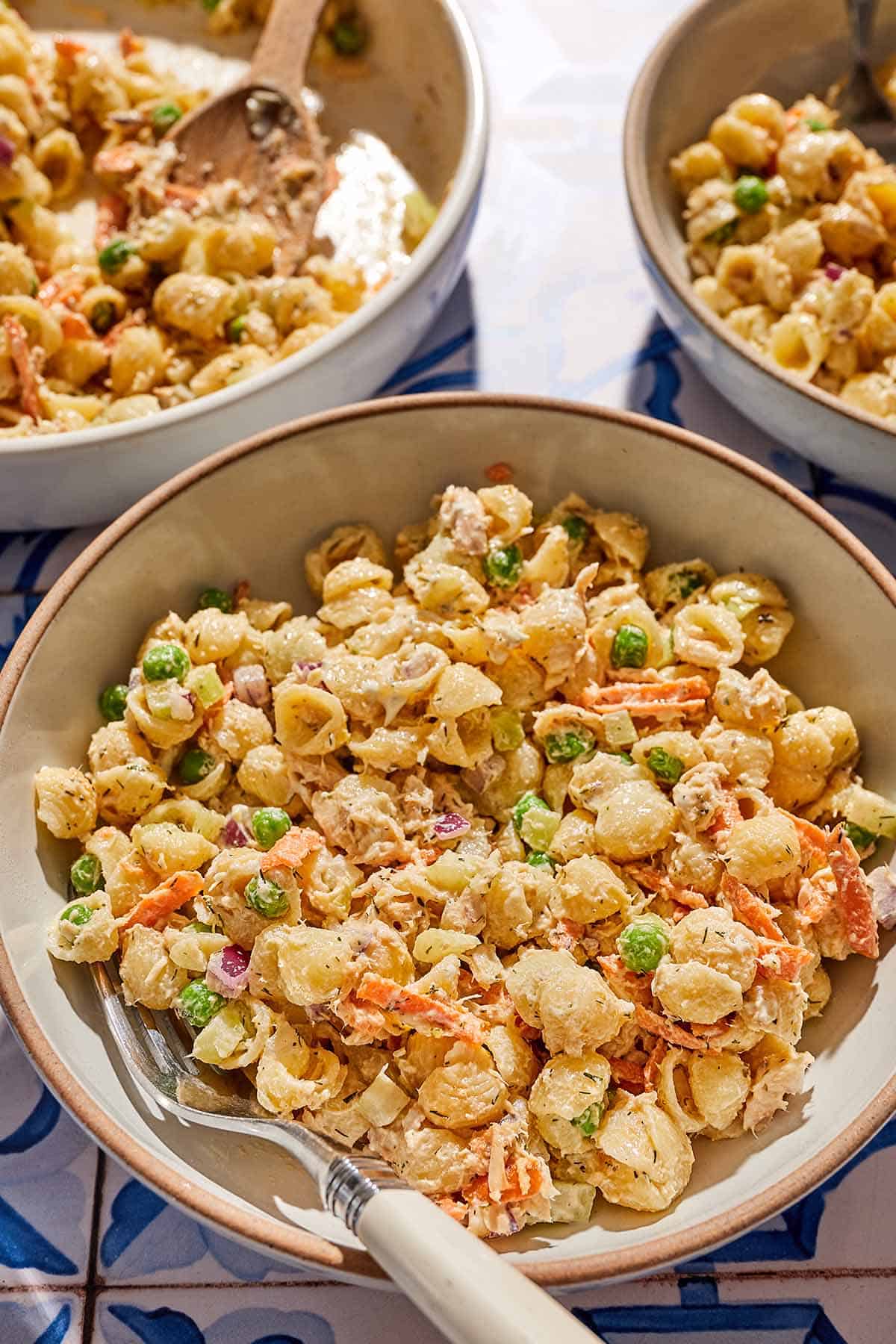 A bowl of tuna pasta with a fork.