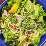 Lemon parmesan lettuce salad in a bowl.