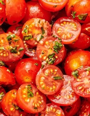 A close up of marinated tomatoes.
