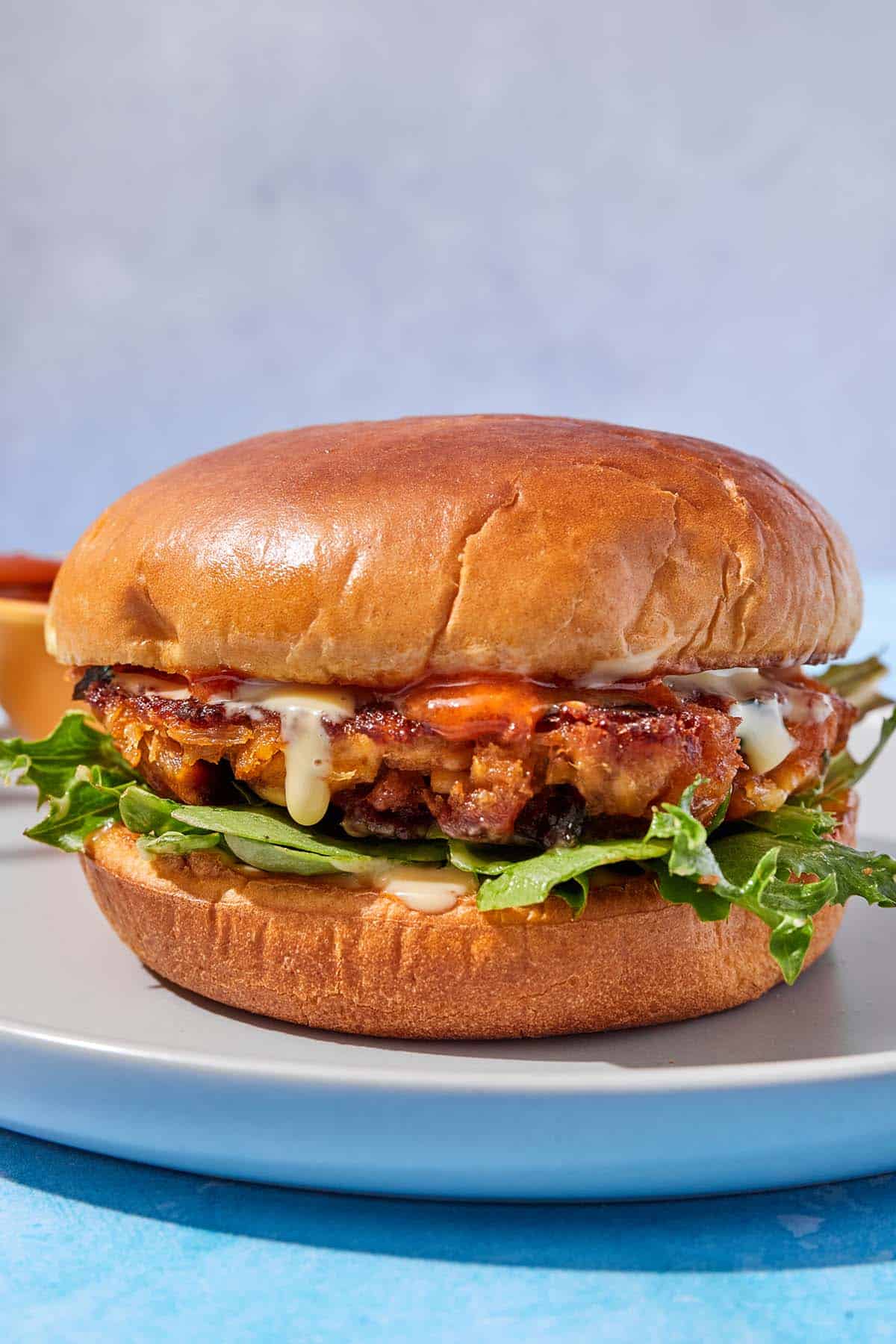 A tuna burger on a plate.