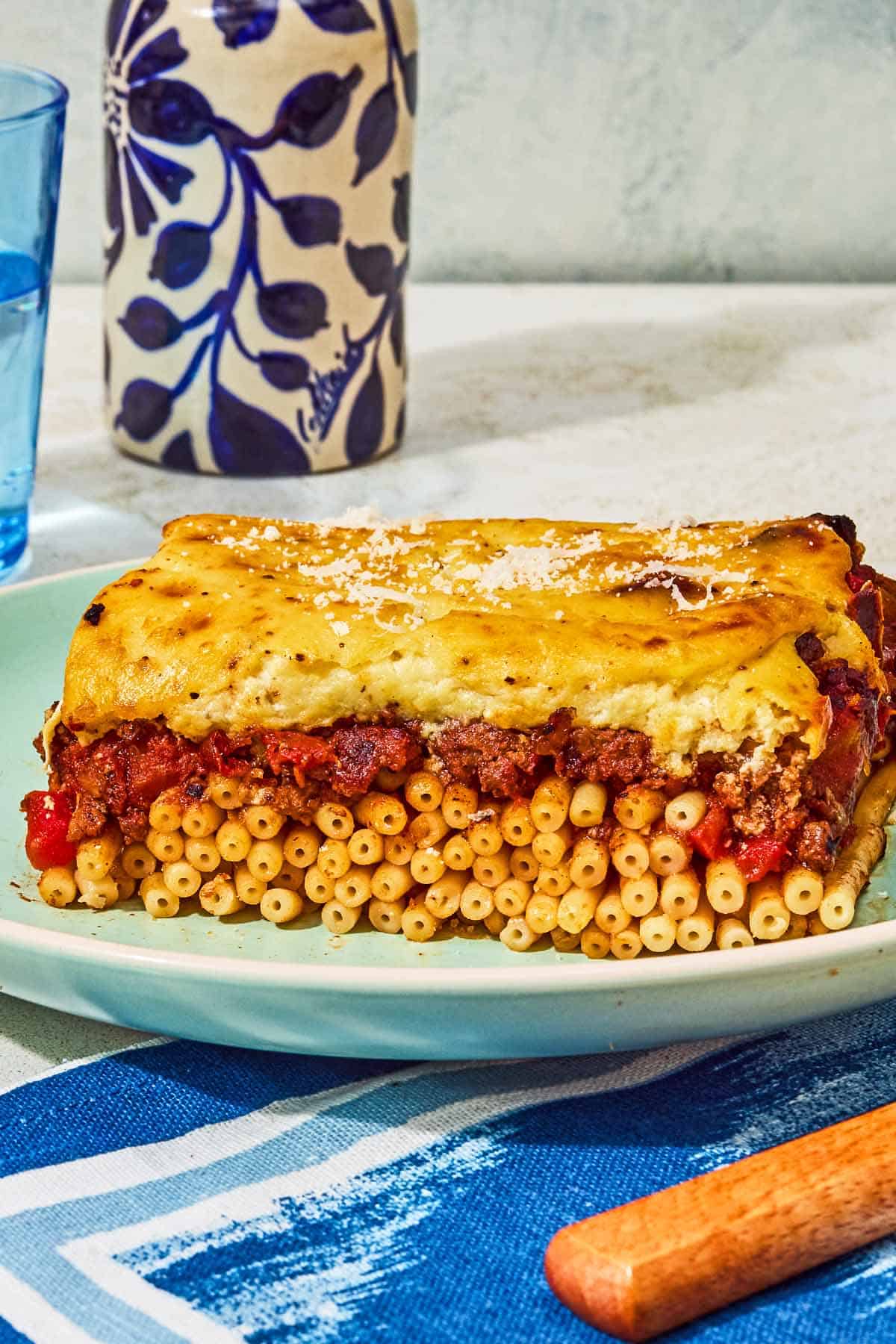 A slice of the pastitsio recipe on a plate.