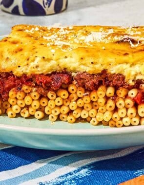 A slice of the pastitsio recipe on a plate.