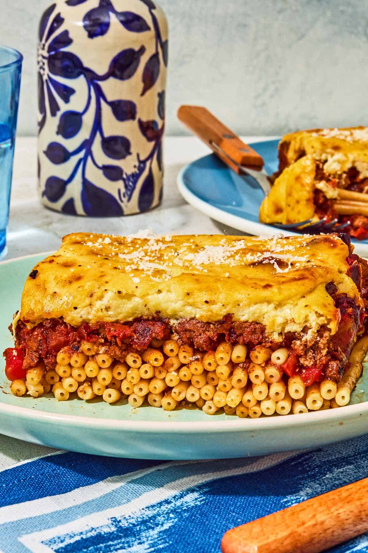 A slice of the pastitsio recipe on a plate.