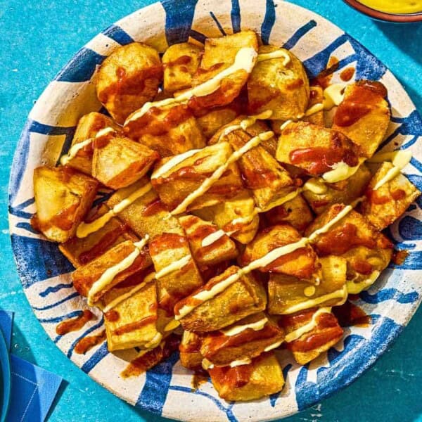 Fried potatoes for the patatas bravas in a serving bowl.