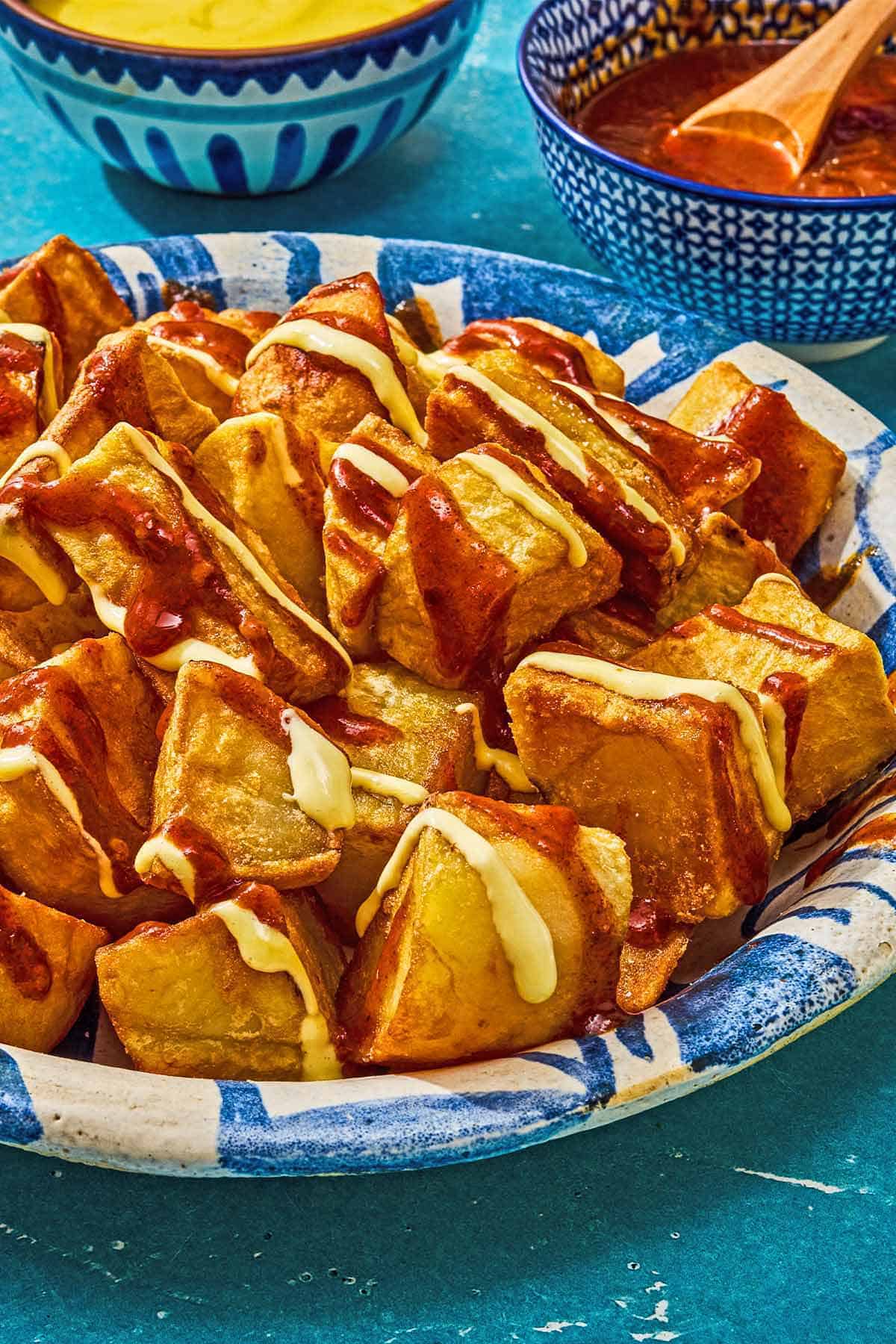 Patatas bravas in a serving bowl.