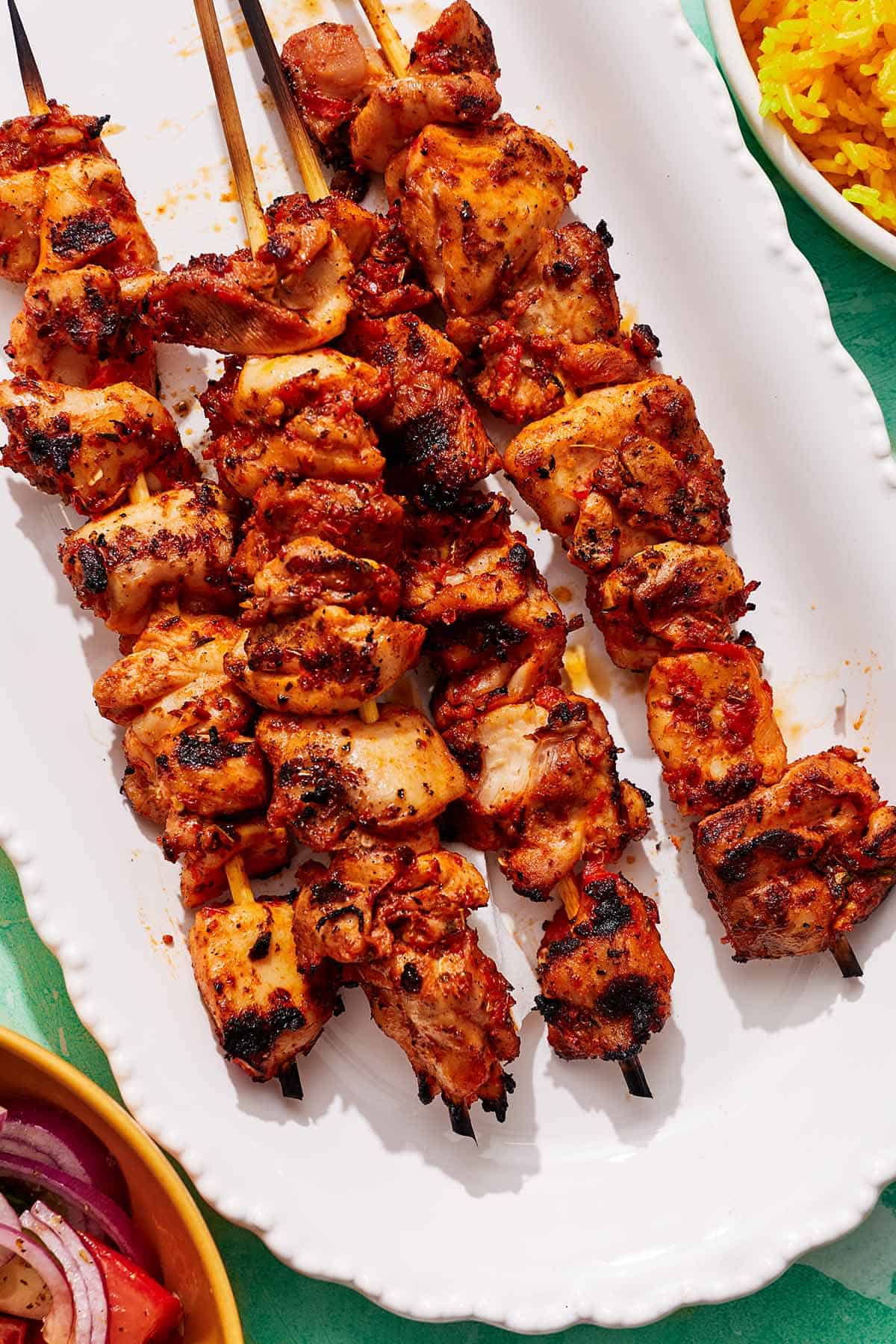 The turkish chicken skewers on a platter.