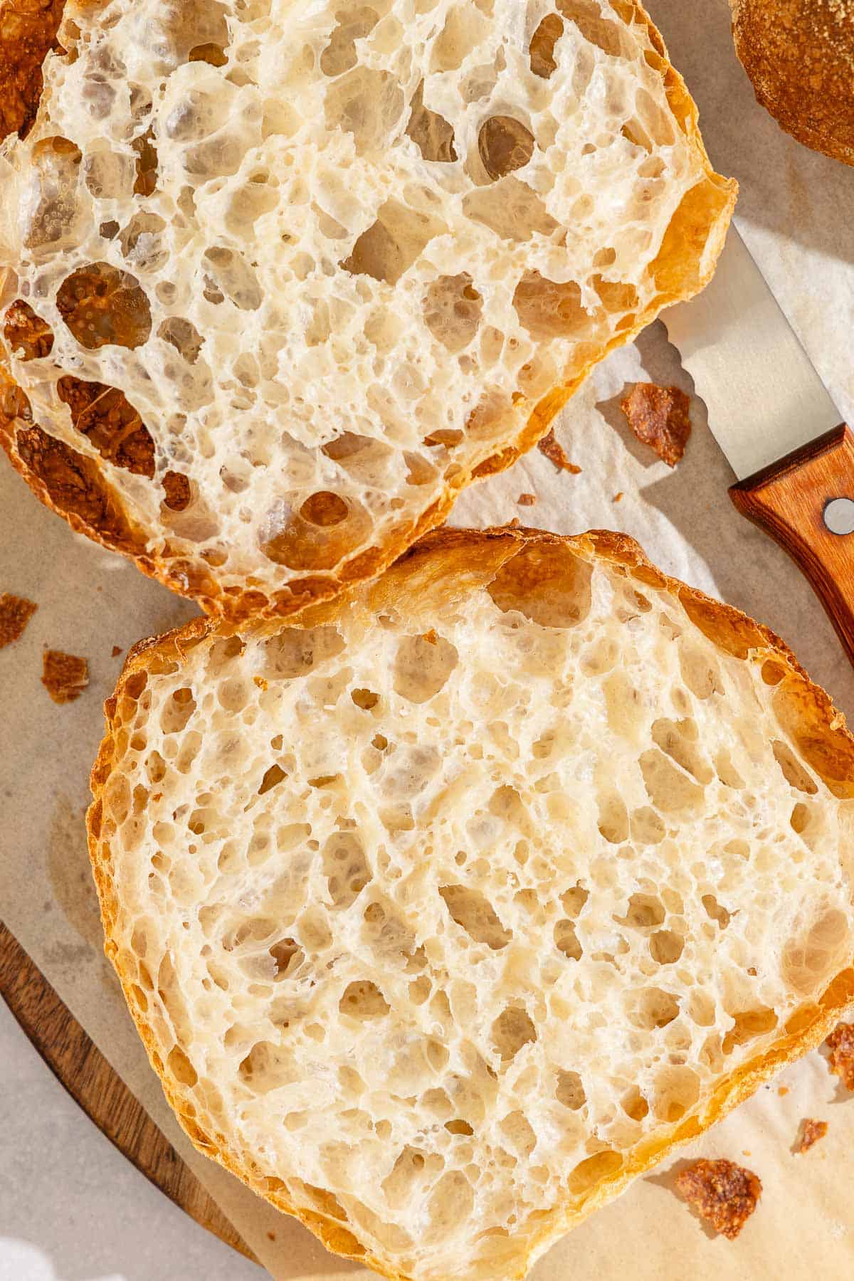 Slices of pan de cristal on a cutting board.