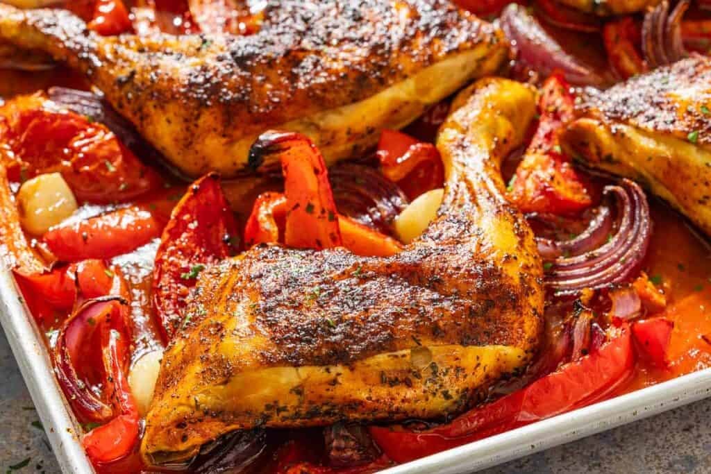 Spanish paprika chicken on a sheet pan.