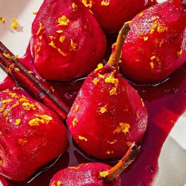 Poached pears on a platter.