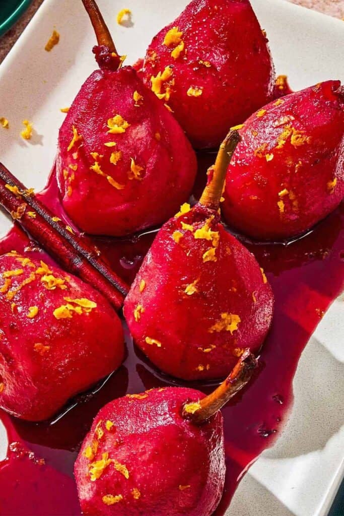 Poached pears on a platter.