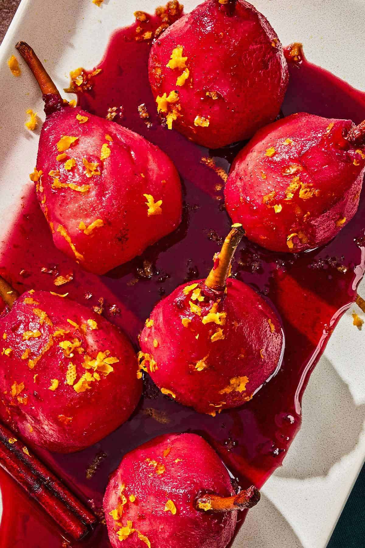 Poached pears on a platter.