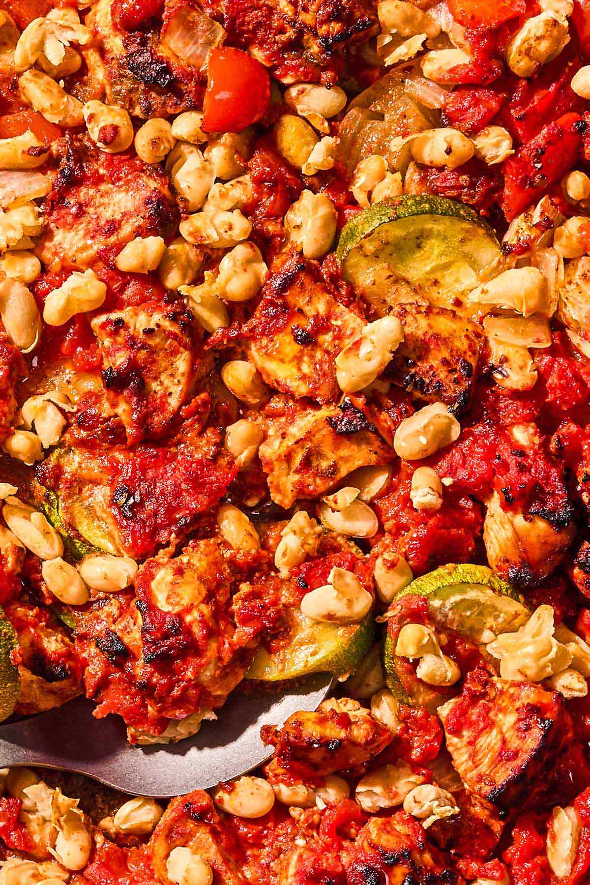 A close up of the sheet pan chicken and vegetables.