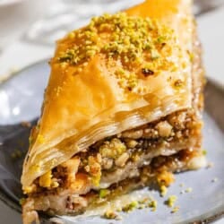 A slice of baklava on a plate.
