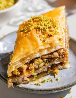 A slice of baklava on a plate.