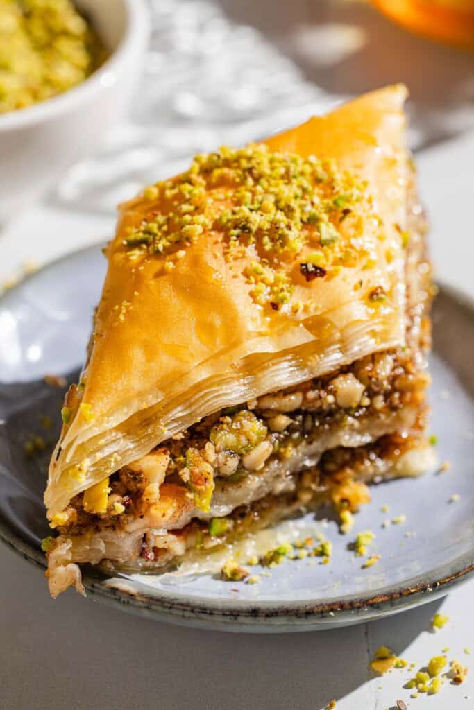 A slice of baklava on a plate.