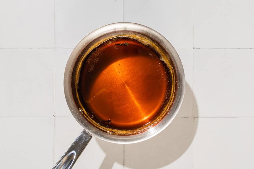 The honey syrup for the baklava in a small saucepan.