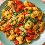 A serving of the skillet gnocchi on a plate with a fork.