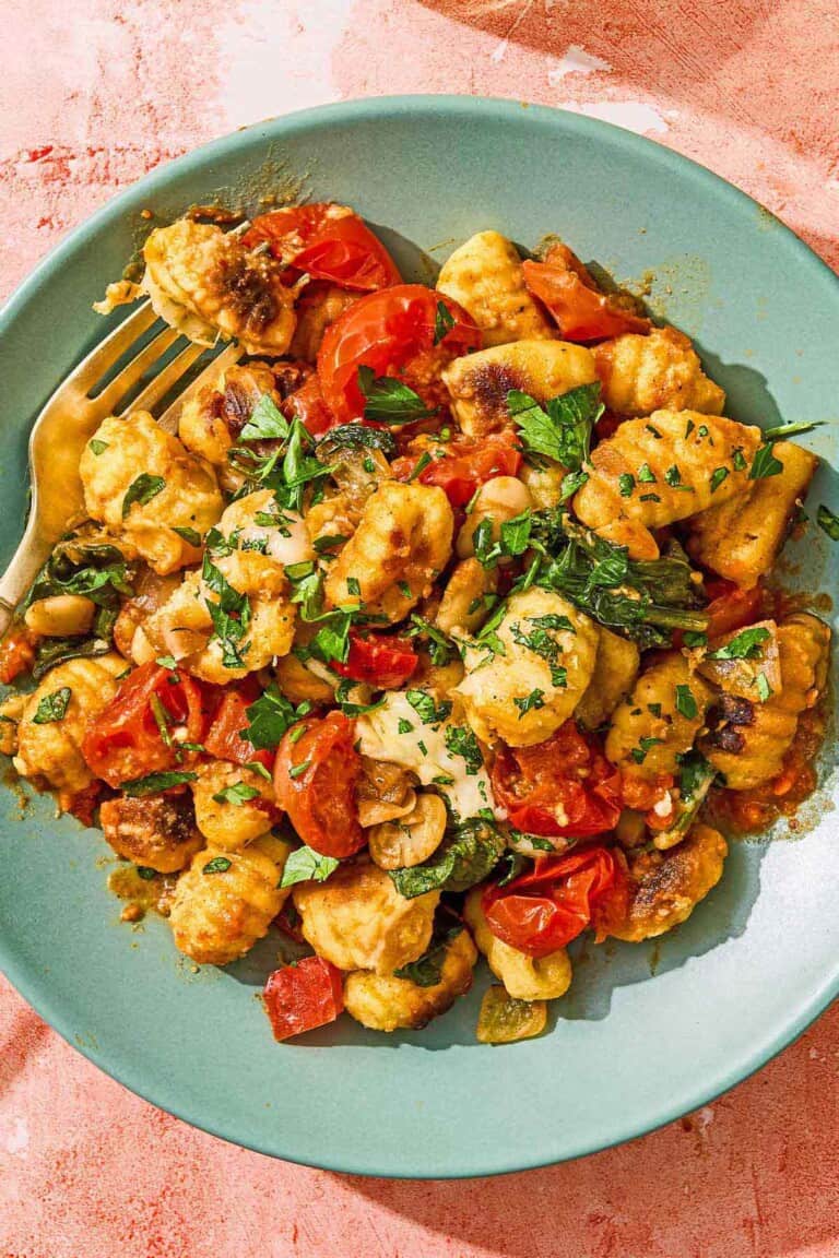 A serving of the skillet gnocchi on a plate with a fork.