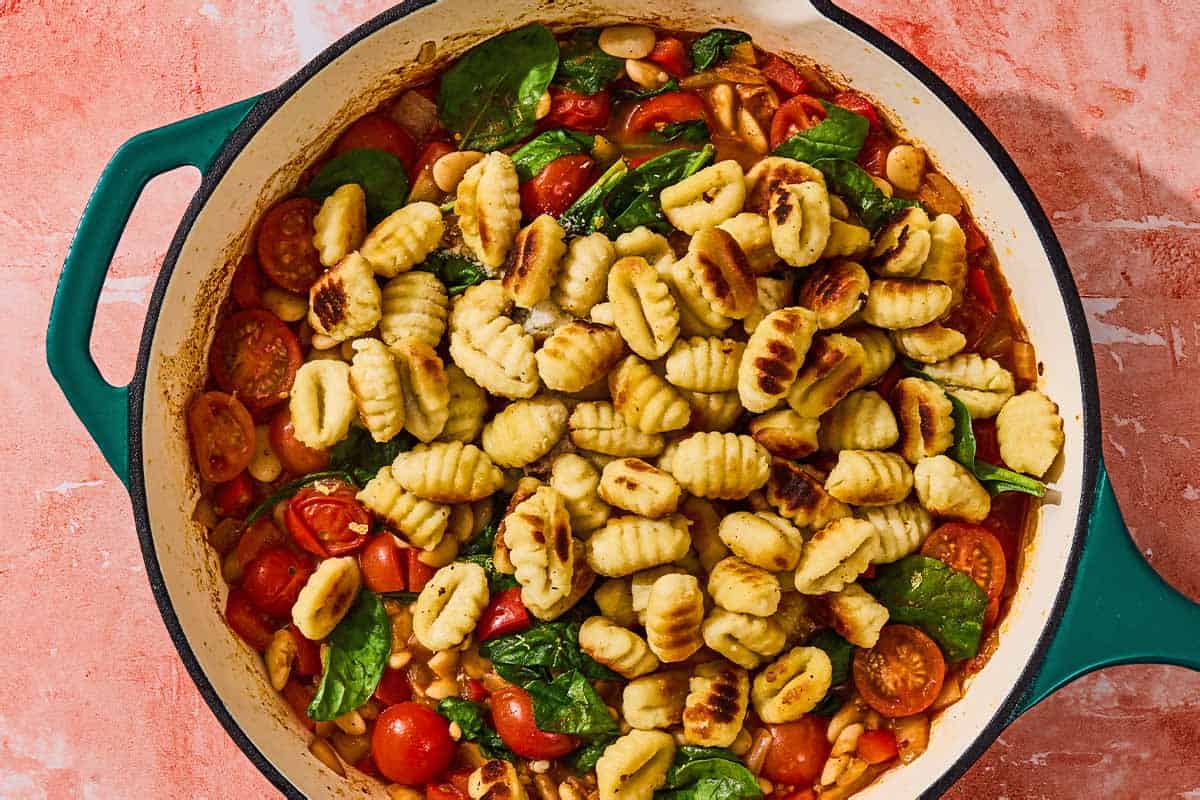 The gnocchi added to the skillet with the rest of the simmering ingredients.